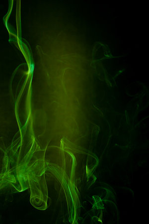 Green smoke motion on black background.の写真素材