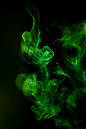 Green smoke motion on black background.の写真素材