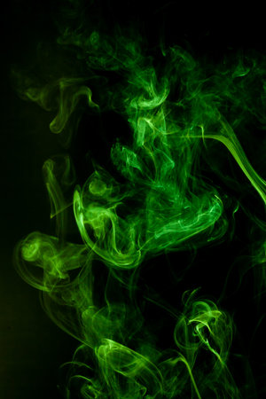 Green smoke motion on black background.の写真素材
