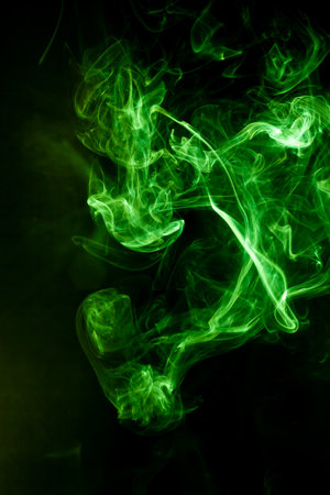 Green smoke motion on black background.の写真素材