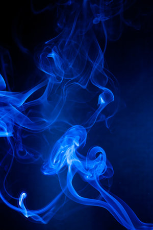 Blue smoke motion on black background.の写真素材