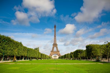 The Eiffel Tower in the morning with some clouds in the sky. Summer timeの写真素材