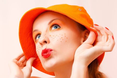Portrait of a nice girl in orange colors and summer moodの写真素材