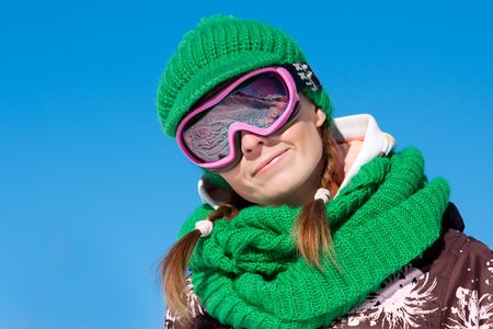 Young sporty girl wearing ski mask and hat. Winter vacation in Alpsの写真素材