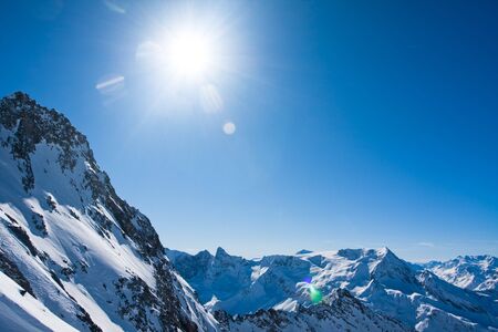 European Alps in Winter. Sun and clear blue sky