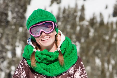 Young sporty girl wearing ski mask and hat. Winter vacation in Alpsの写真素材