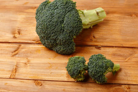 The green broccoli on the wooden backgroundの写真素材