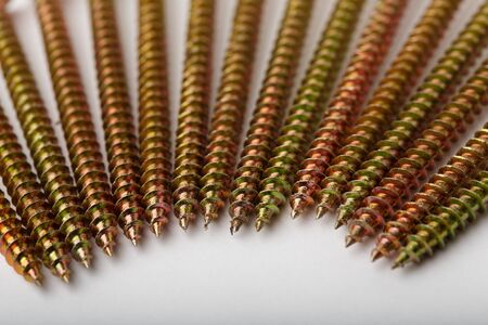 There are metal screws  on white background