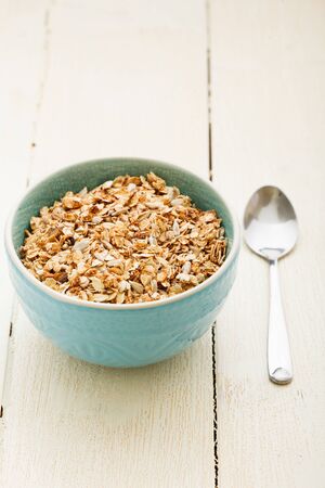 It is oatmeal porridge on white wooden tableの写真素材