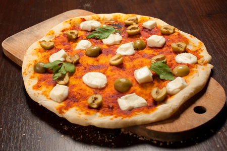 Pizza with mozzarella and olivesの写真素材