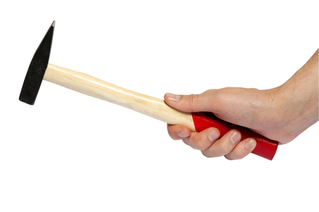The hand holding the hammer isolated on a white backgroundの写真素材