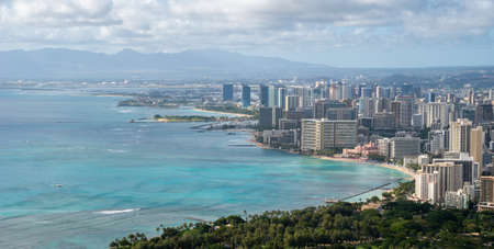 Vista on coastal city with azure waters, shot at Diamond Head Lookout near Honolulu, Hawaii, USAの写真素材