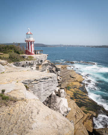 Lighthouse on the edge of the cliff shot at Hornby Lighthouse in Sydney, New South Wales, Australiaの写真素材