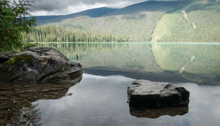 Reflection on pristine alpine lake shot at Emerald Lake, Yoho National Park, British Columbia, Canadaの写真素材