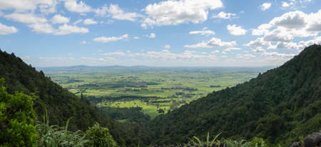 Green landscape panorama with cloudy sky s in Waikato region of New Zealand.の写真素材