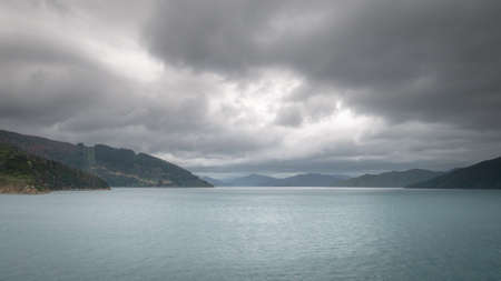 Views on ocean strait during overcast day,Taken while on ferry heading from North to South Island, New Zealandの写真素材