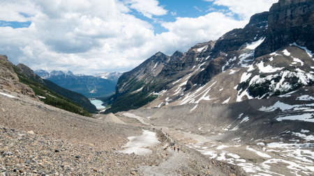 View on alpine valley with turquoise lake on its end. Shot in Lake Louise area, Banff National Park, Alberta, Canadaの写真素材