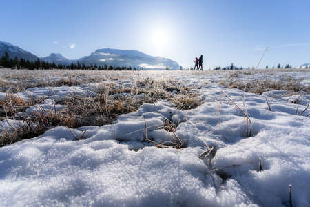 Hikers in Canadian Rockies in late winter, shot around Quarry Lake, Canmore, Alberta, Canadaの写真素材