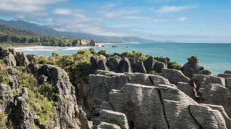 Unusual rock formations on oceans coast shot during sunny day, Picture made at Punakaiki Pancake Rocks, West Coast, New Zealandの写真素材
