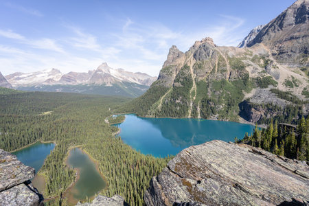 Beautiful view on alpine valley with glacial lakes surrounded by mountainsの写真素材