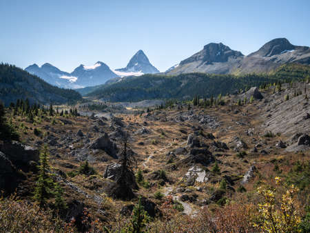 Autumn alpine valley with prominent peak on its end, Mt Assiniboine Provincial Park, Canadaの写真素材