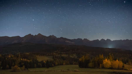 Beautiful night landscape with sky full of stars above rocky mountain range, Europe, Slovakiaの写真素材