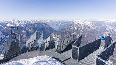 Viewing platform above winter alpine landscape with valley, mountains and lake, Austria, Europeの写真素材