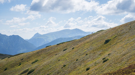 Hikers in distance walking the ridge in alpine environment, Slovakia, Europeの写真素材
