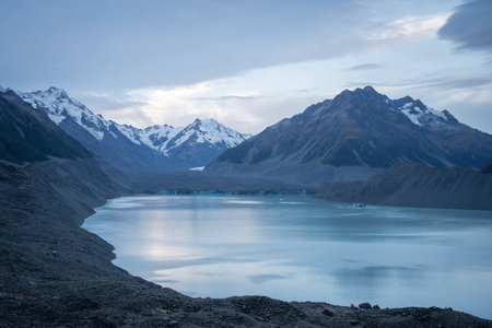 Wide glacier landscape scenery with snowy mountain, glacier and glacial lake at front, New Zealand