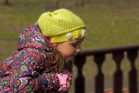 girl standing at the fence