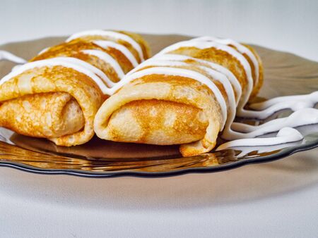 pancakes with sour cream on a plateの写真素材