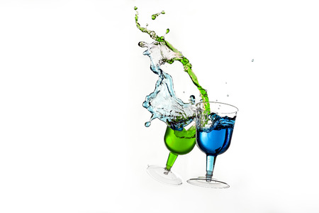 Dancing lasses with colorful liquors making liquor splashの写真素材