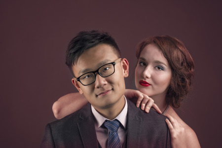 Portrait of young, beautiful lovers in fashion shot.の写真素材