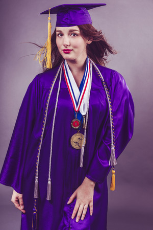 Portrait of female graduation during fashion shots.の写真素材