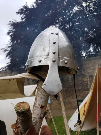 An early medieval Nasal helmet on a wooden post.の写真素材