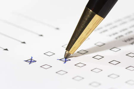 different columns with checkboxes, voting with ball pen by tickの写真素材