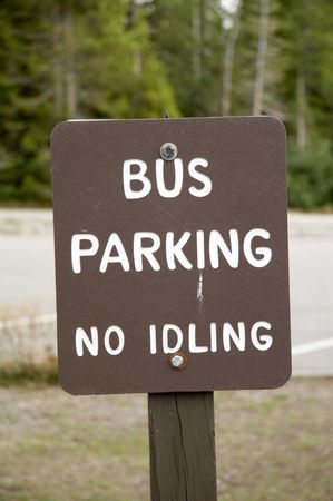 sign - BUS PARKING - NO IDLING on a parking lot - portrait formatの写真素材