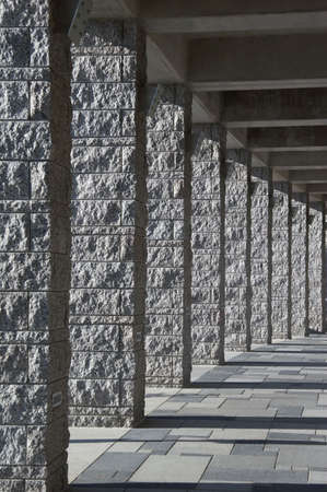 gray granite pillar - roofed course with light and shadows - portrait formatの写真素材