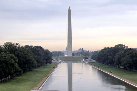 washington monument, the large white colored obelisk with mirrage in the pond. The Capitol in backgroundの写真素材