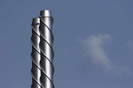 modern smokestack in chrome with decorationの写真素材