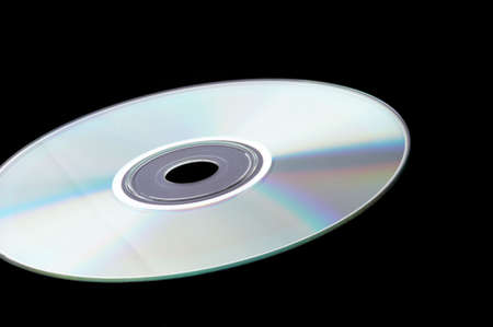 Single DVD on black background - landscape formatの写真素材