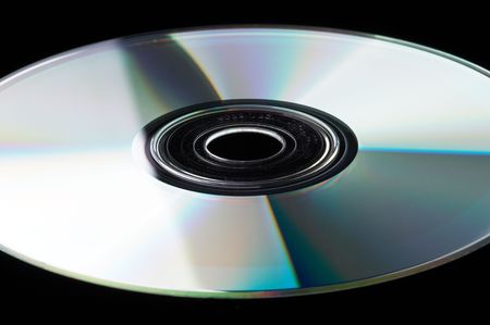 Single DVD on black background - landscape formatの写真素材