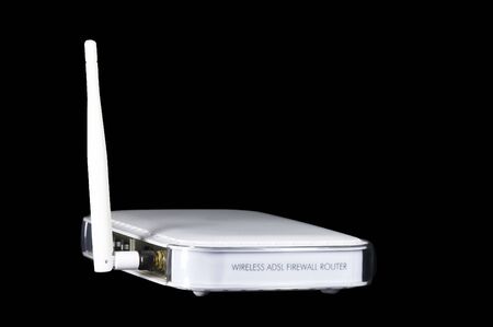 white wireless wlan adsl modem firewall router with antenna and black backgroundの写真素材