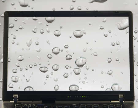 notebook isolated with rain drops on screen