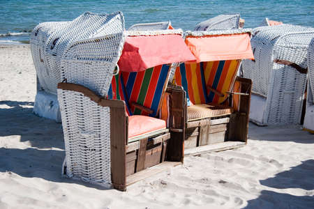 roofed wicker beach chair on the beachの写真素材