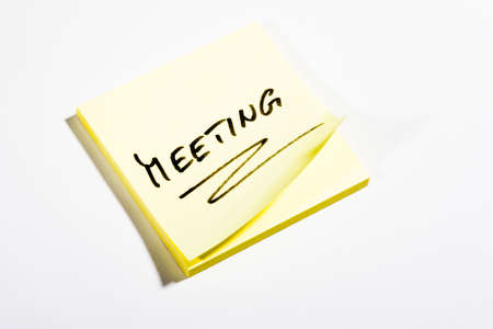 Yellow Post-It with MEETING - on white backgroundの写真素材