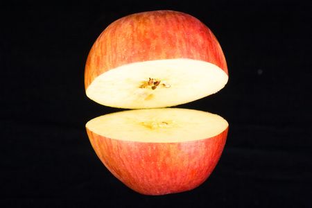 Red Apple on black backgroundの写真素材