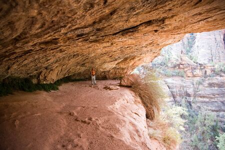Woman hiking in Zion National Park - located in the Southwestern USA, near Springdale, Utahの写真素材
