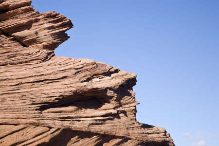Visible rock stratum - red sandstonein front of blue sky in Arizona, USAの写真素材