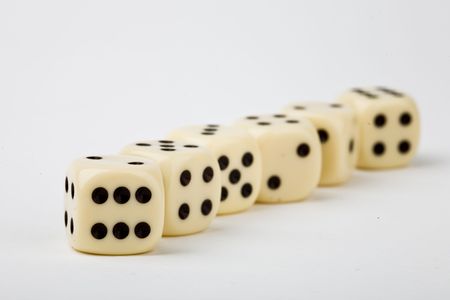 Rolling dice on white background